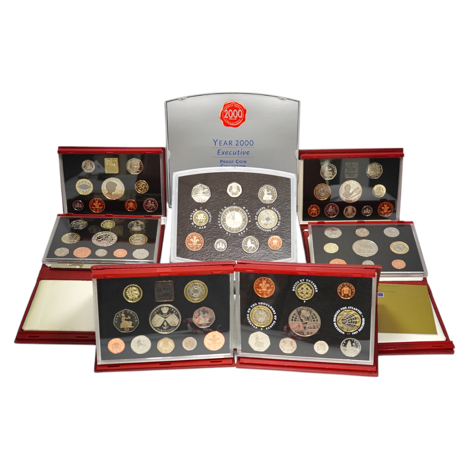 British coins, QEII, Royal Mint, seven UK proof coins sets, deluxe 1997-1999 and 2001-2003 and executive 2000